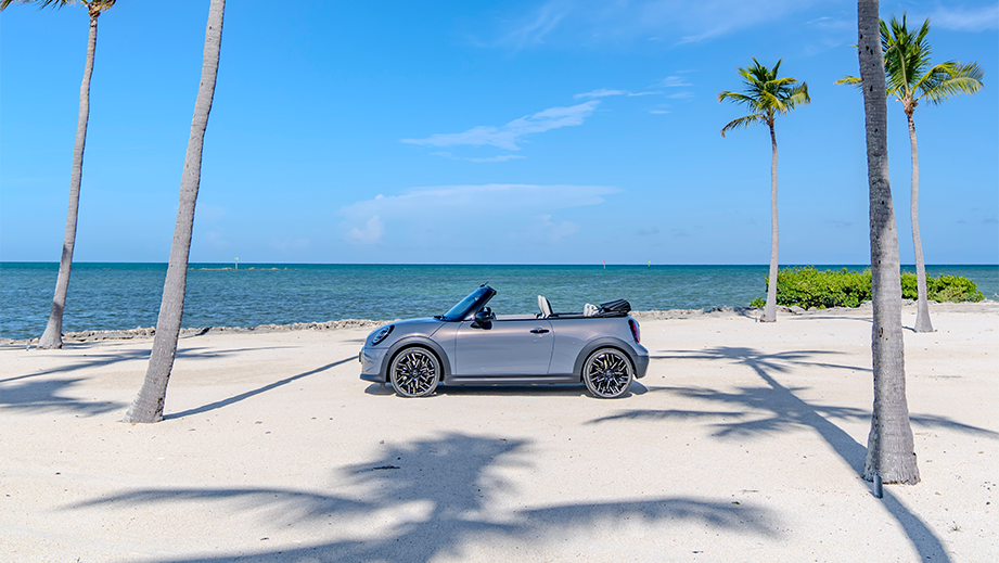Side view of a Mini Cooper S Convertible on a beach