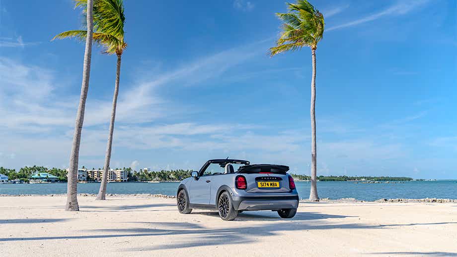 Rear view of a Mini Cooper S Convertible on a beach