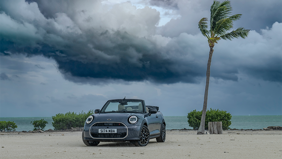 Front view of a Mini Cooper S Convertible on a beach