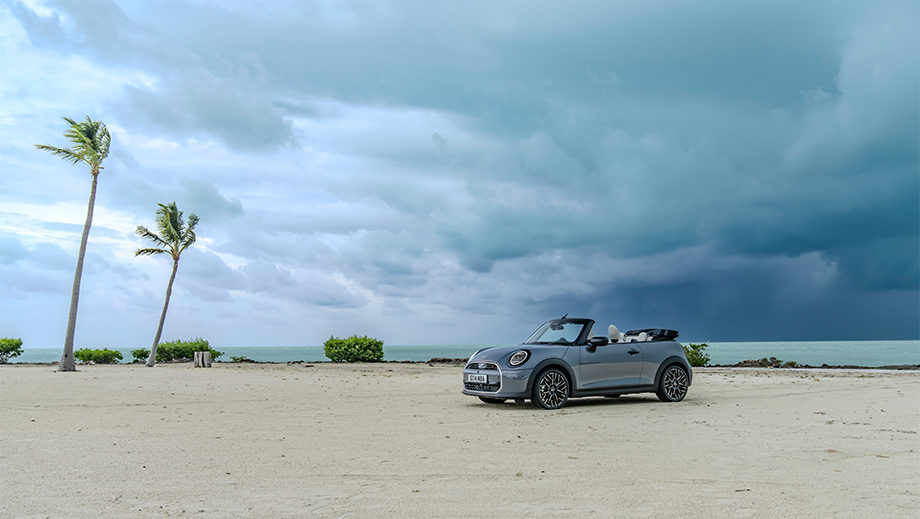 Front three quarter view of a Mini Cooper S Convertible on a beach