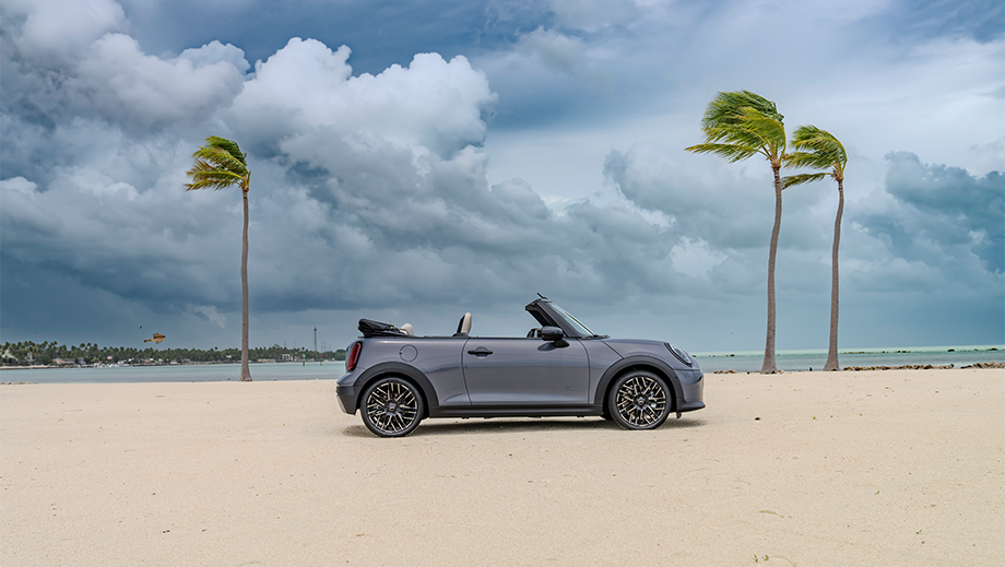 Side view of a Mini Cooper S Convertible on a beach