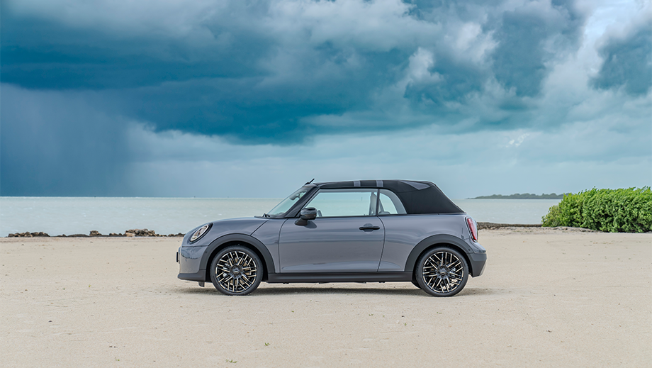 Side view of a Mini Cooper S Convertible on a beach