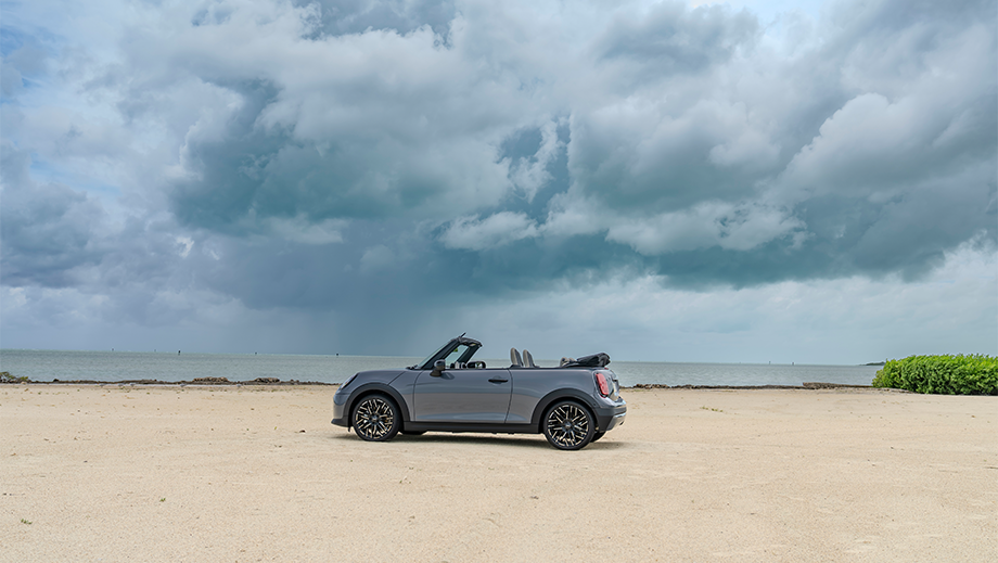 Side view of a Mini Cooper S Convertible on a beach