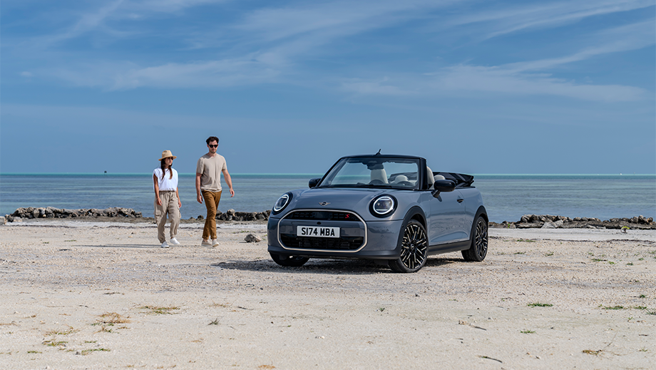 Front view of a Mini Cooper S Convertible on a beach