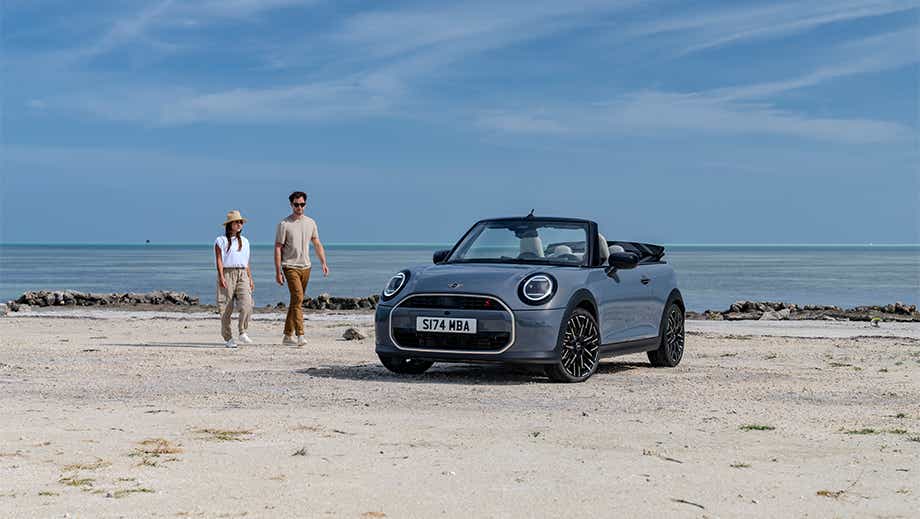 Front view of a Mini Cooper S Convertible on a beach