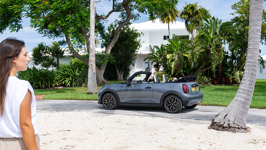 Side view of a Mini Cooper S Convertible parked on a street