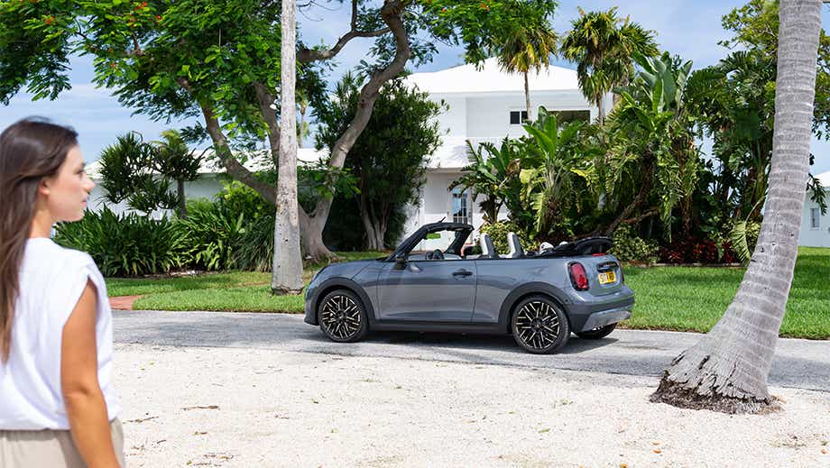 Side view of a Mini Cooper S Convertible parked on a street