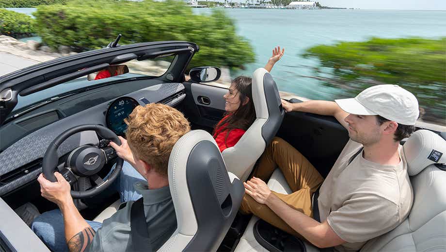 Interior view of a Mini Mini Cooper S Convertible with passengers
