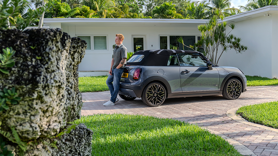 Side view of a Mini Cooper S Convertible outside a house