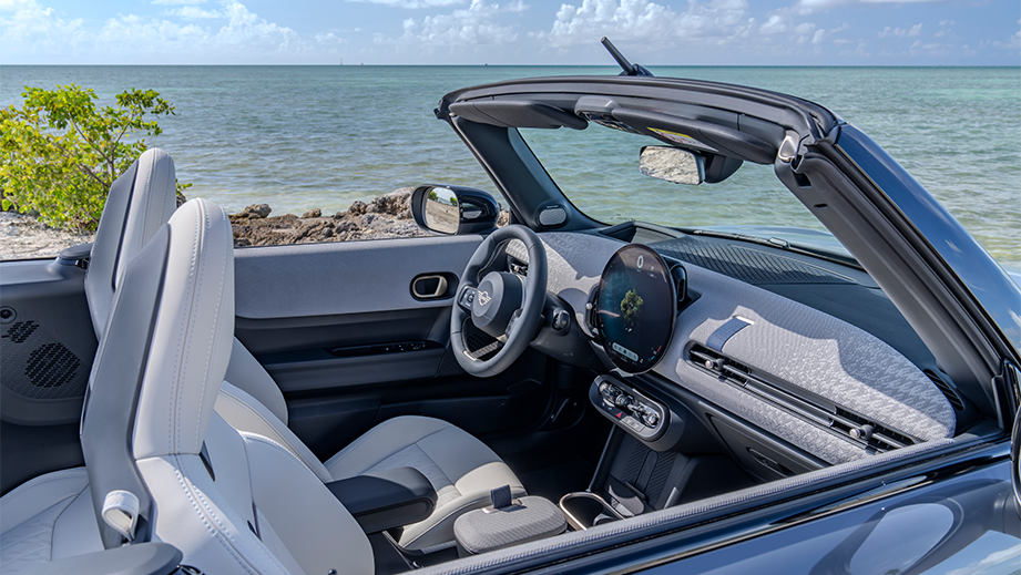 Interior front seats and dashboard of a Mini Cooper S Convertible by the ocean