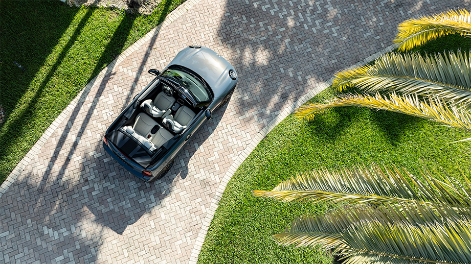 Top view of a Mini Cooper S Convertible on a paved driveway