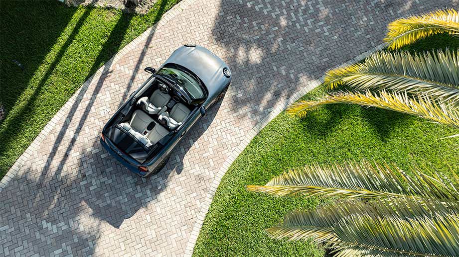 Top view of a Mini Cooper S Convertible on a paved driveway