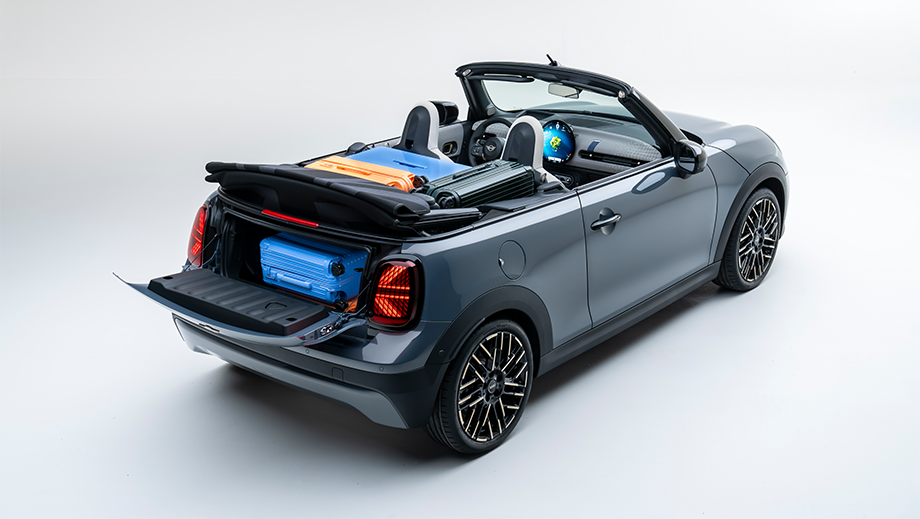 Rear three-quarter view of a Mini Cooper S Convertible with luggage