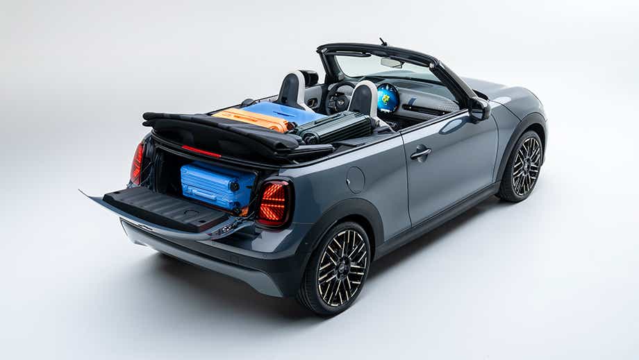 Rear three-quarter view of a Mini Cooper S Convertible with luggage