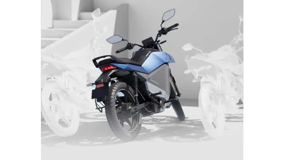 Rear three-quarter view of a Stellar Blue OLA Roadster X Plus