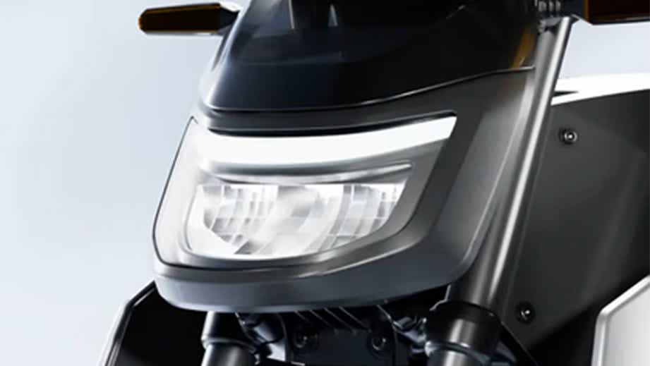 Headlight close-up of a OLA Roadster X Plus