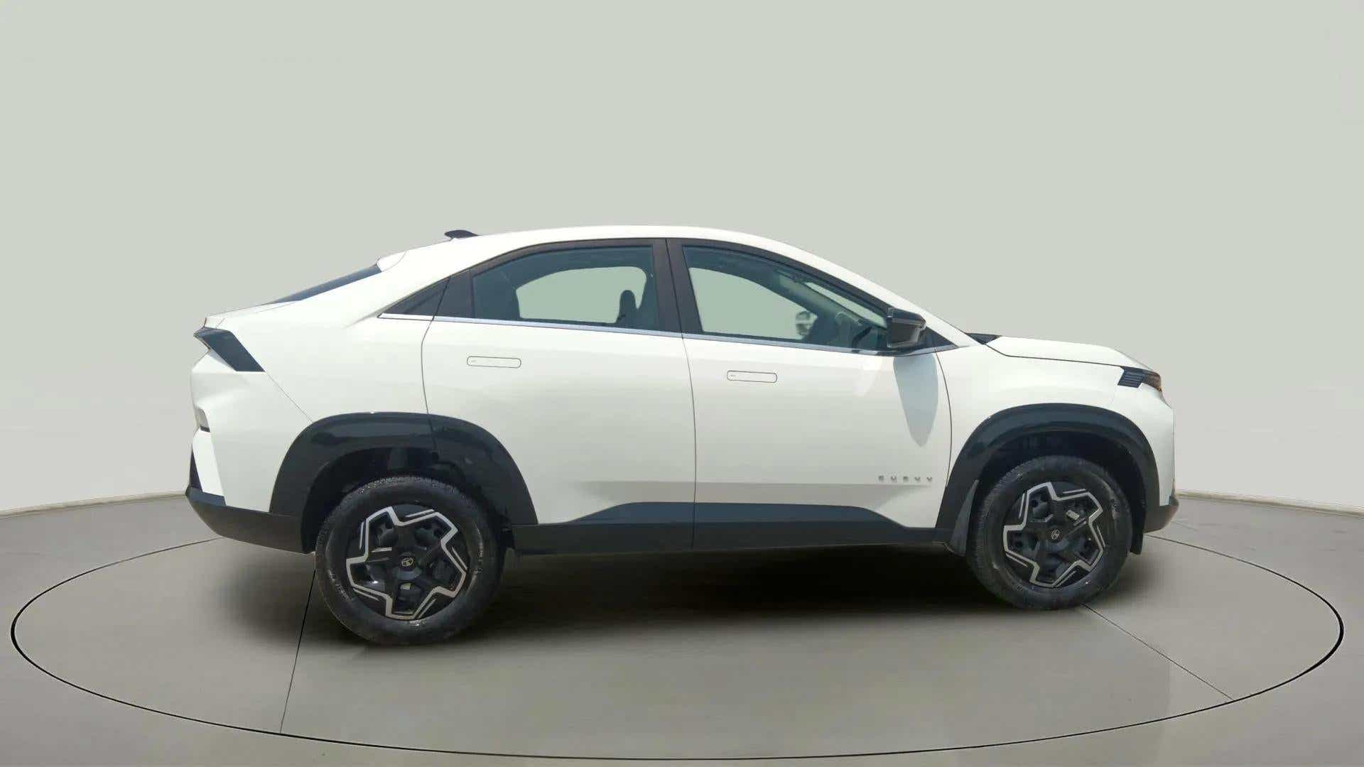 Side profile of a Pristine White Tata Curvv