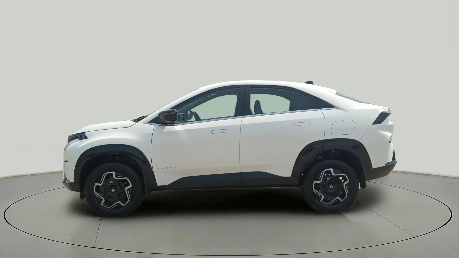 Side view of a Pristine White Tata Curvv
