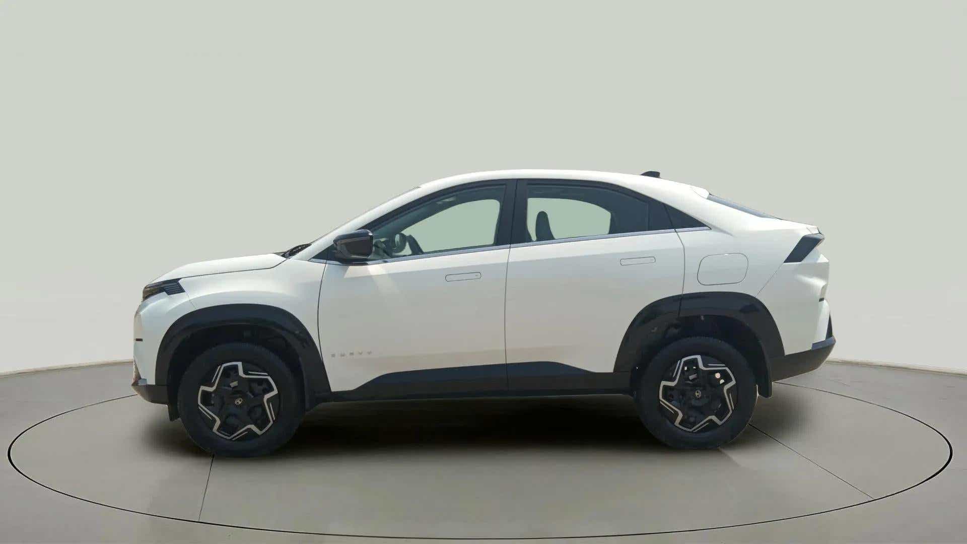 Side view of a Pristine White Tata Curvv