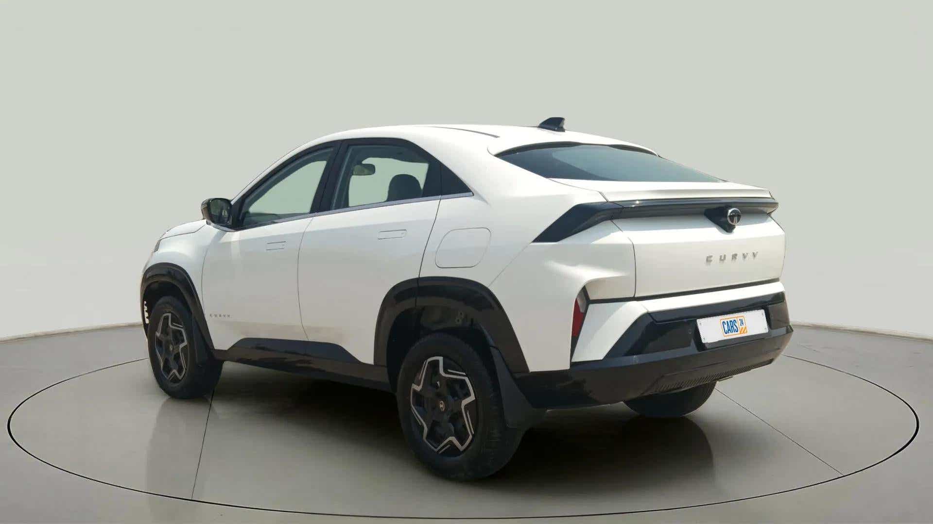 Rear three-quarter view of a Pristine White Tata Curvv