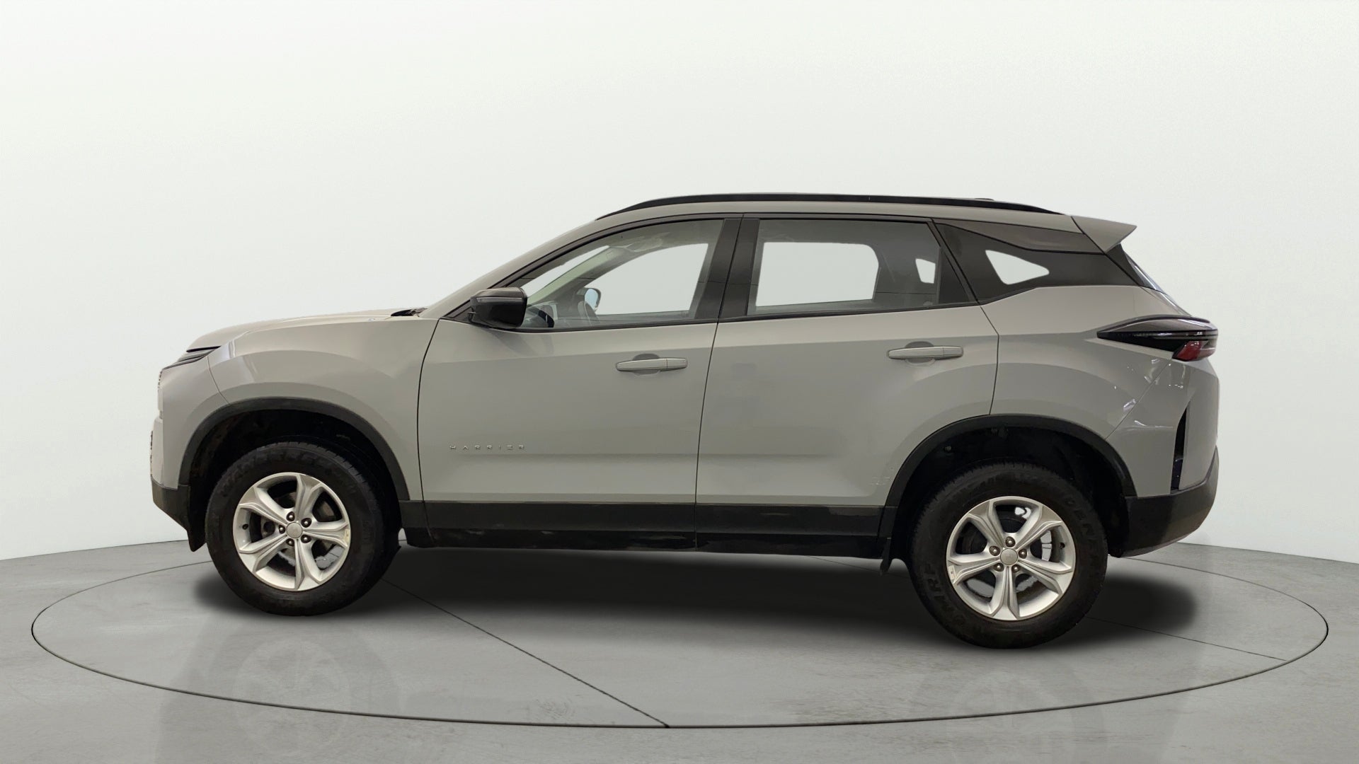 Side profile of a Pebble Grey Tata Harrier
