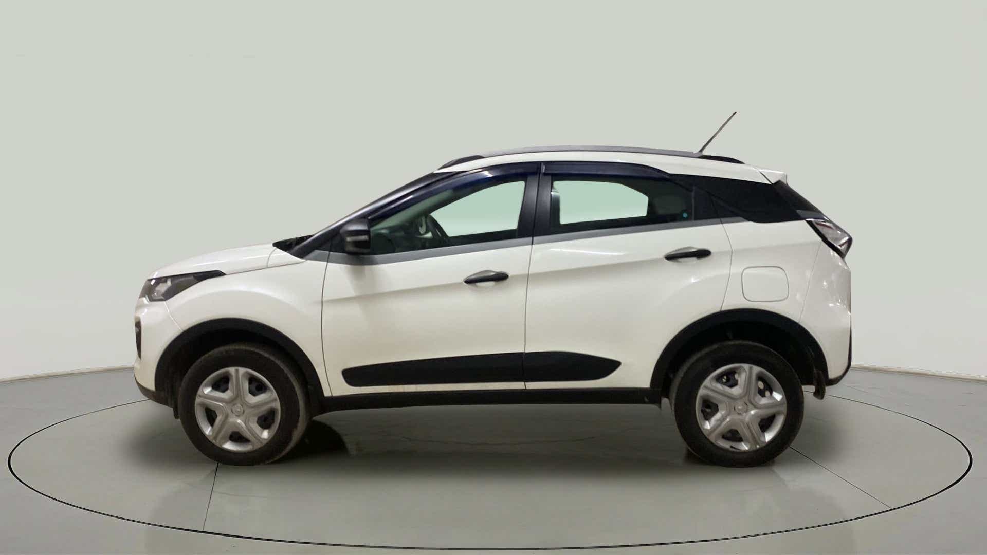Side view of a Calgary White Tata Nexon 2017-2023