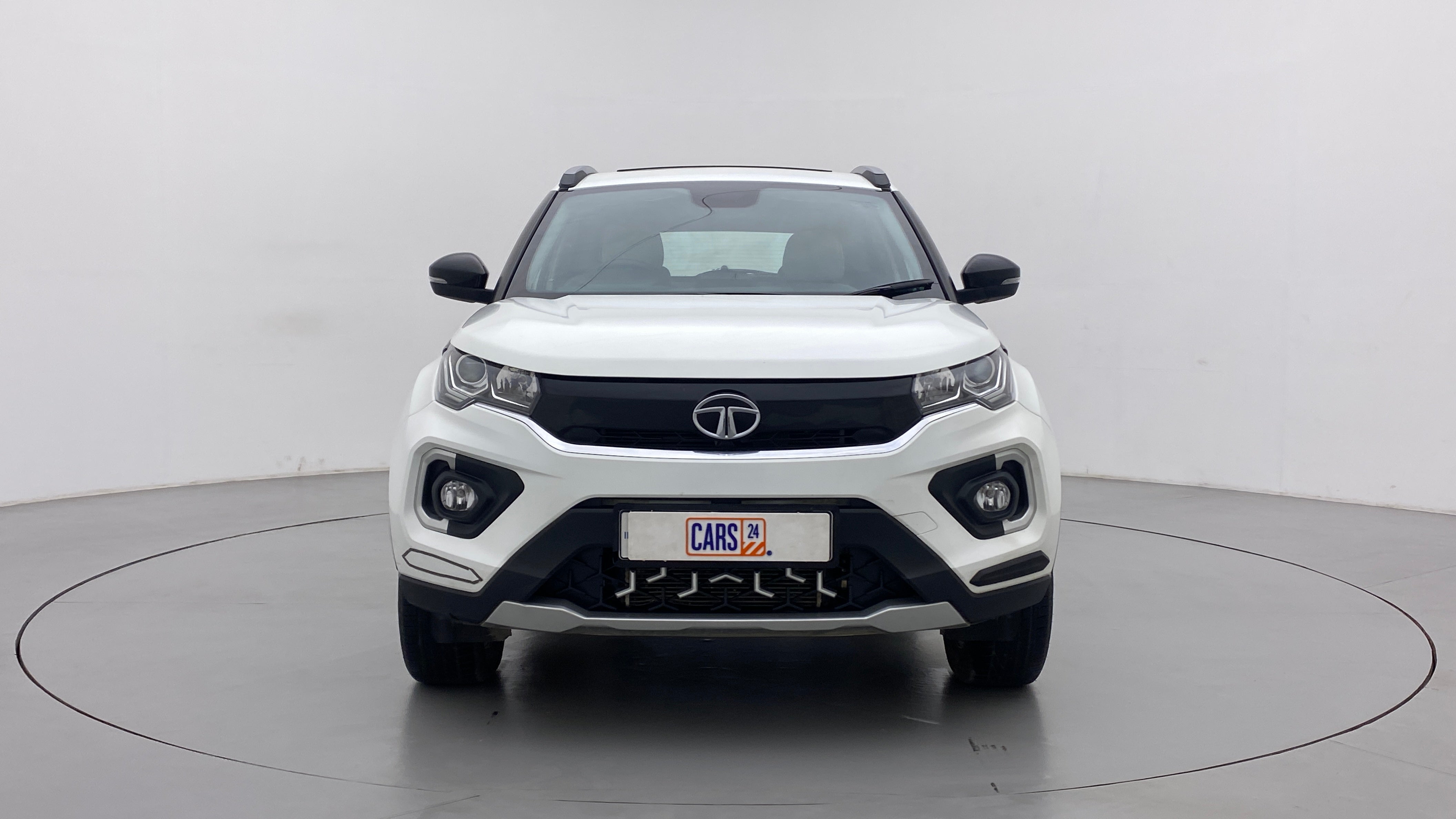 Front view of a Calgary White Tata Nexon 2017-2023