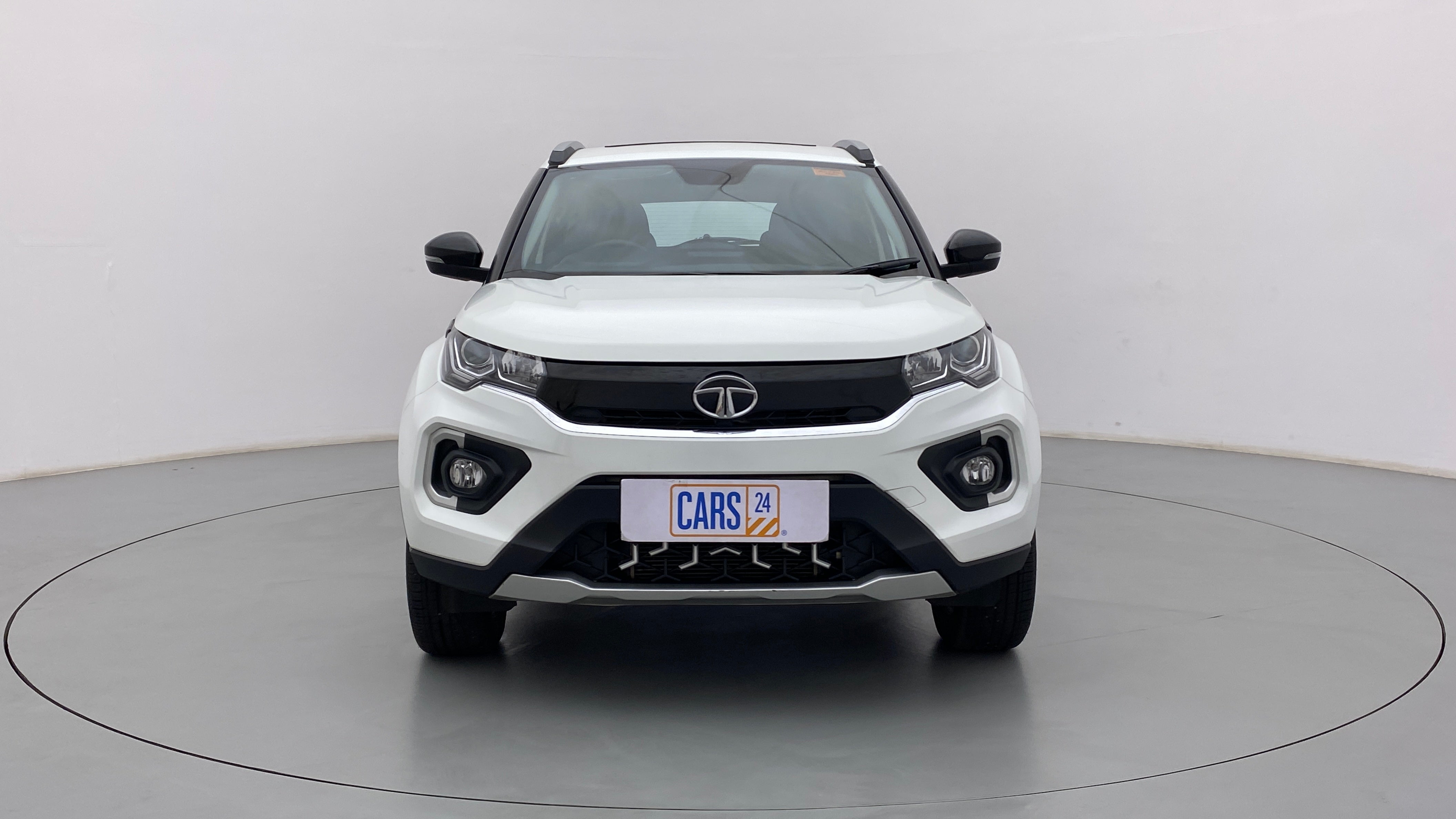 Front view of a Calgary White Tata Nexon 2017-2023