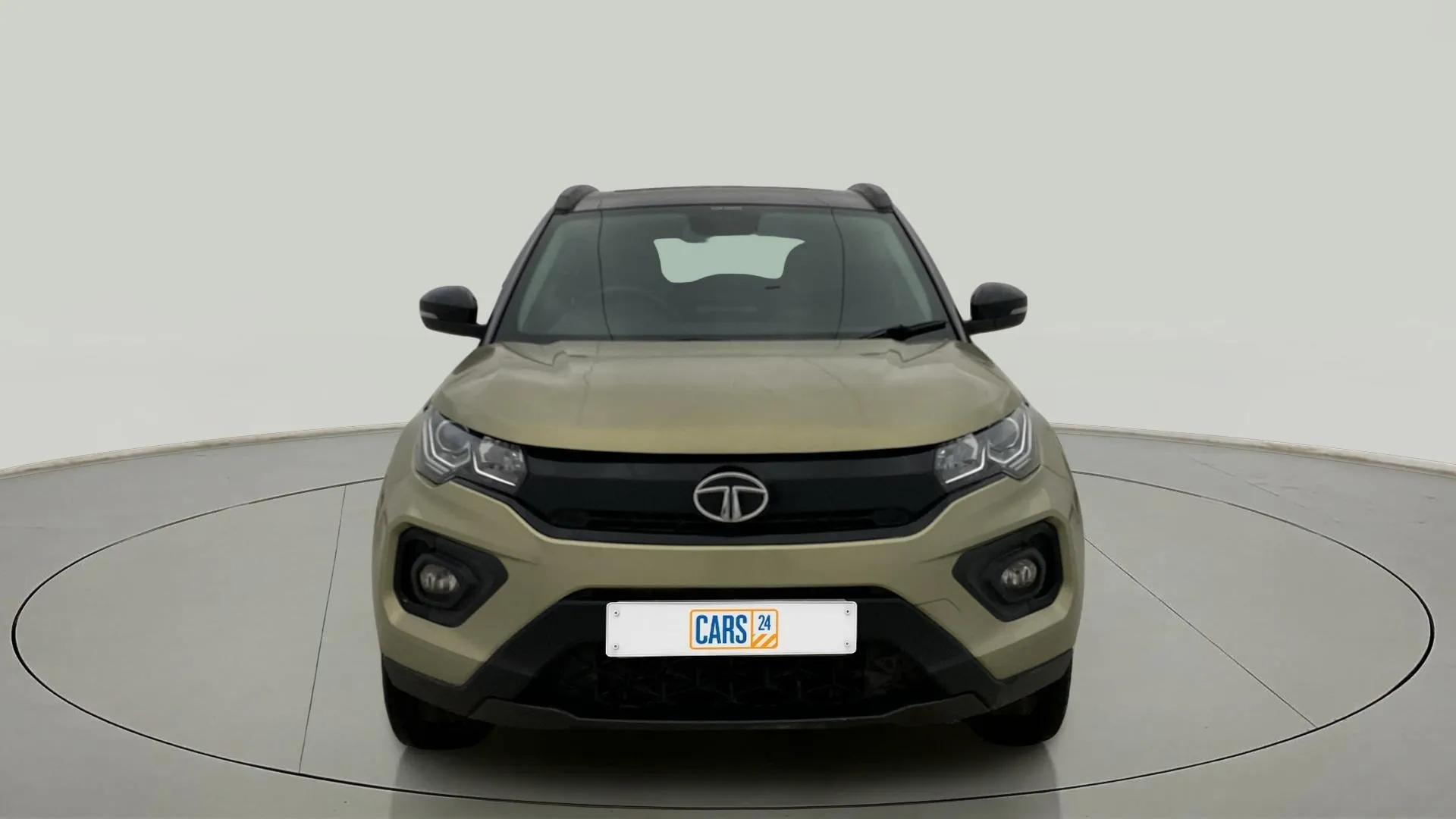 Front view of a Grassland Beige Tata Nexon 2017-2023
