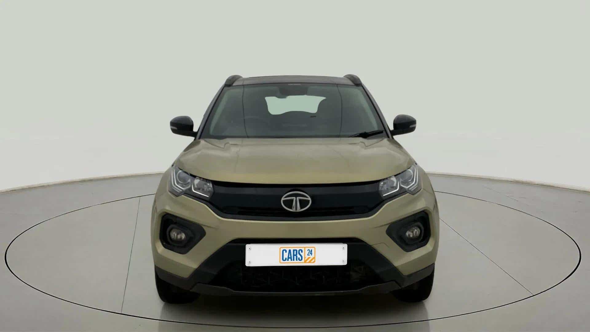 Front view of a Grassland Beige Tata Nexon 2017-2023