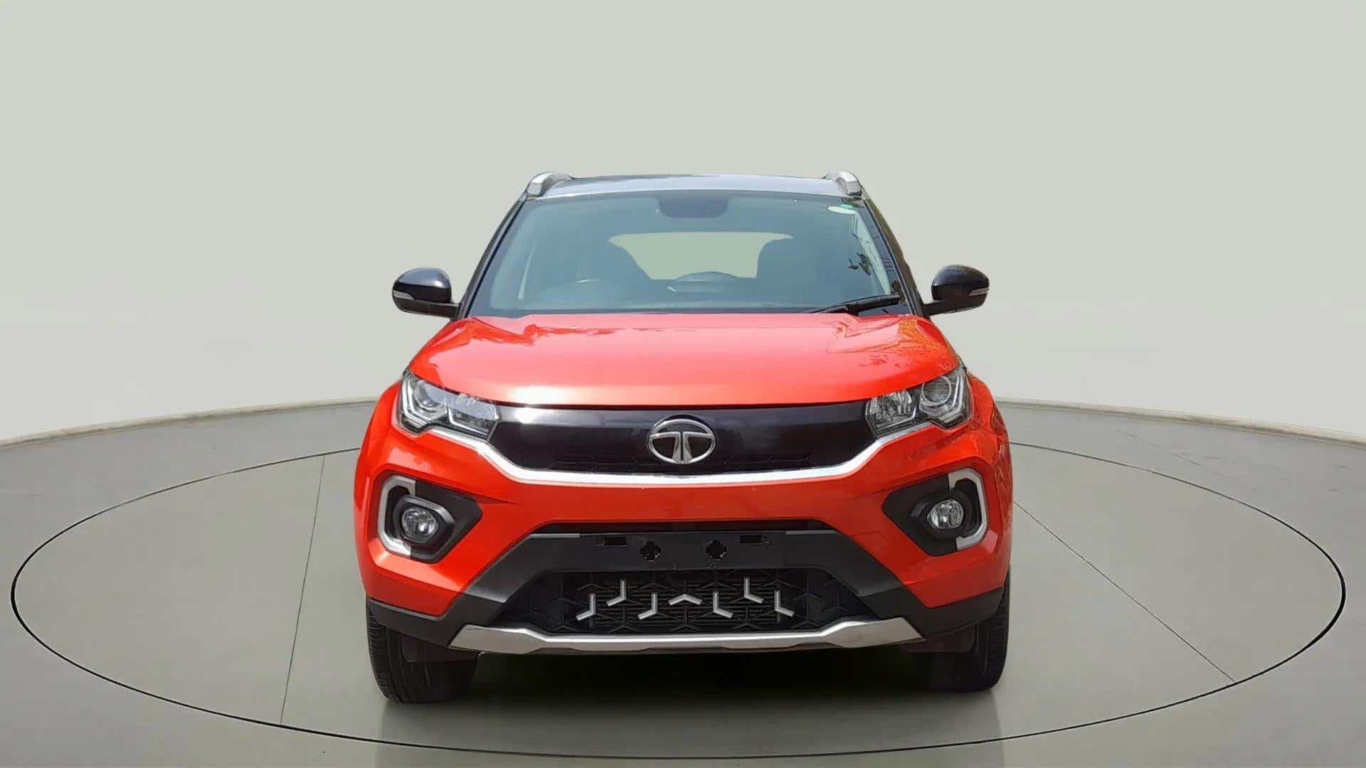 Front view of a flame red Tata Nexon 2017-2023