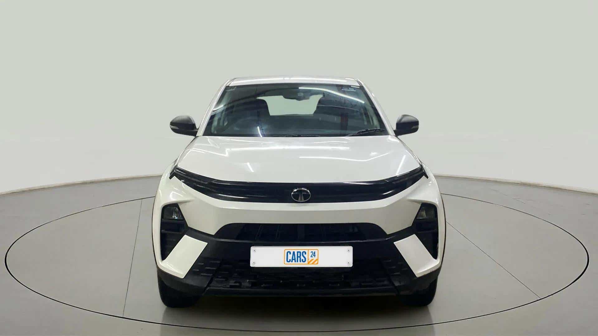 Front view of a Calgary White Tata Nexon