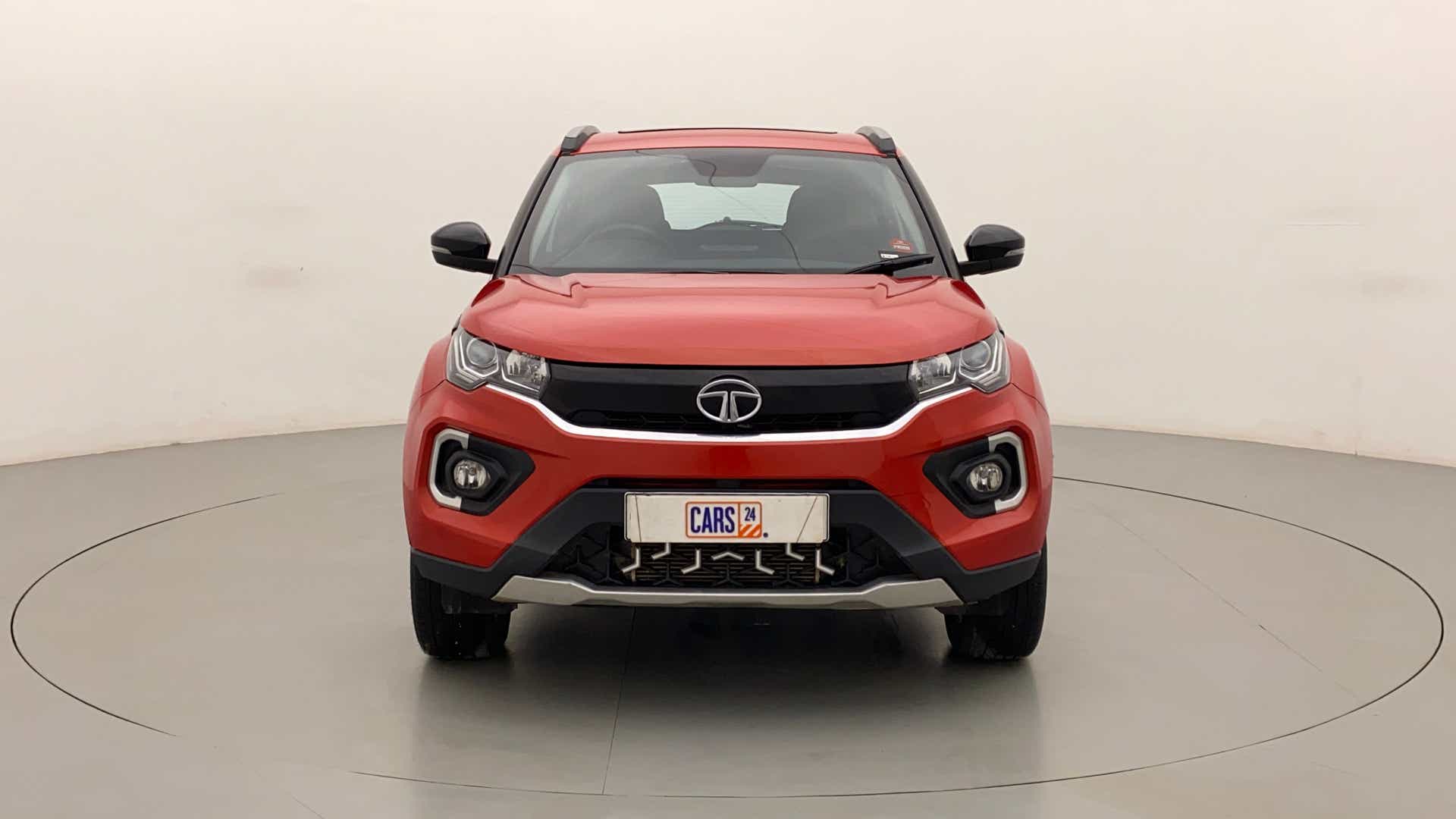Front view of a flame red Tata Nexon 2017-2023