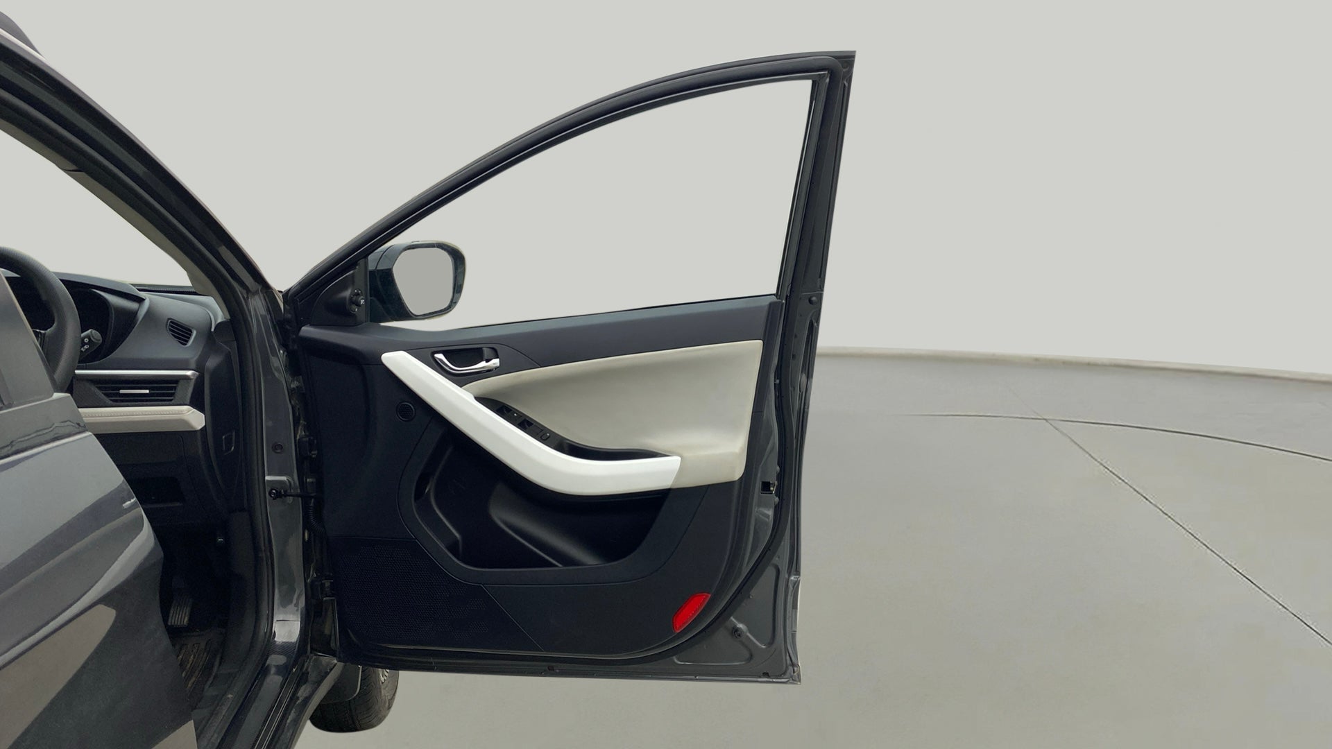 Interior driver side door panel of a Tata Nexon