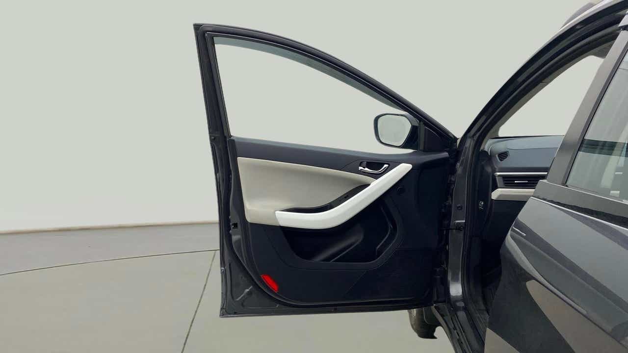 Front driver-side door and dashboard of a Tata Nexon