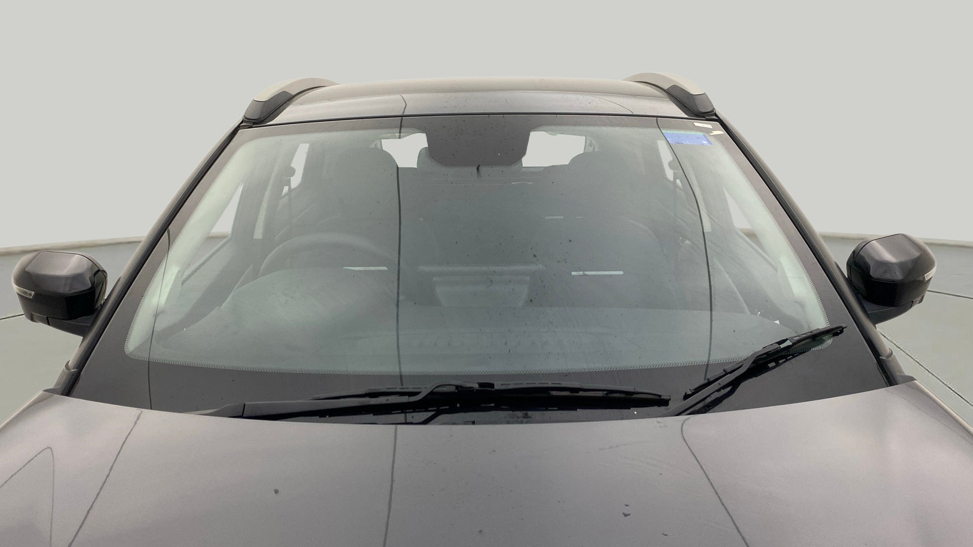 Front windshield and mirrors of a Tata Nexon