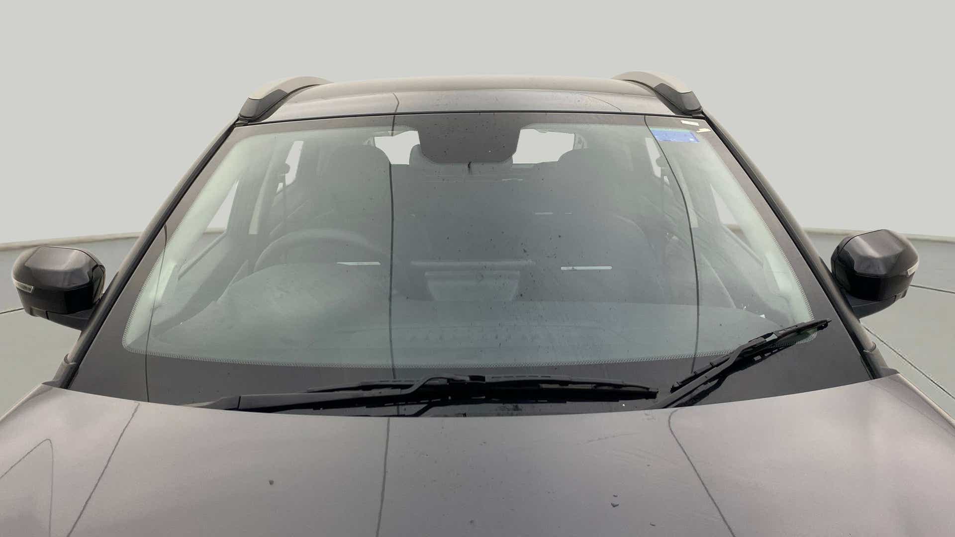 Front windshield and mirrors of a Tata Nexon