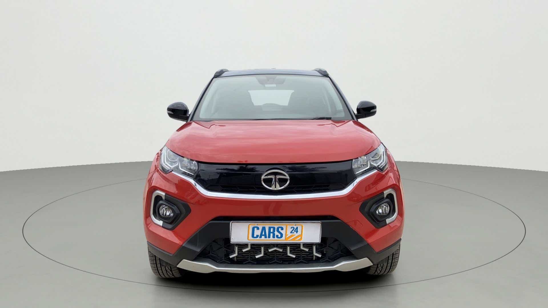 Front view of a flame red Tata Nexon 2017-2023