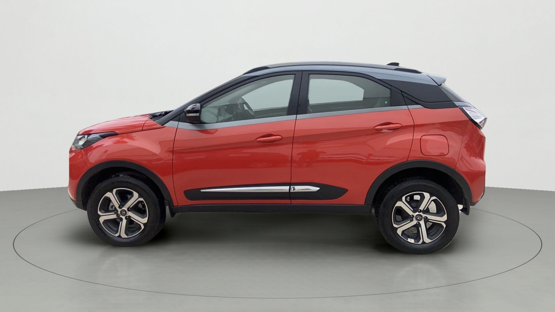 Side view of a Flame Red Tata Nexon 2017-2023