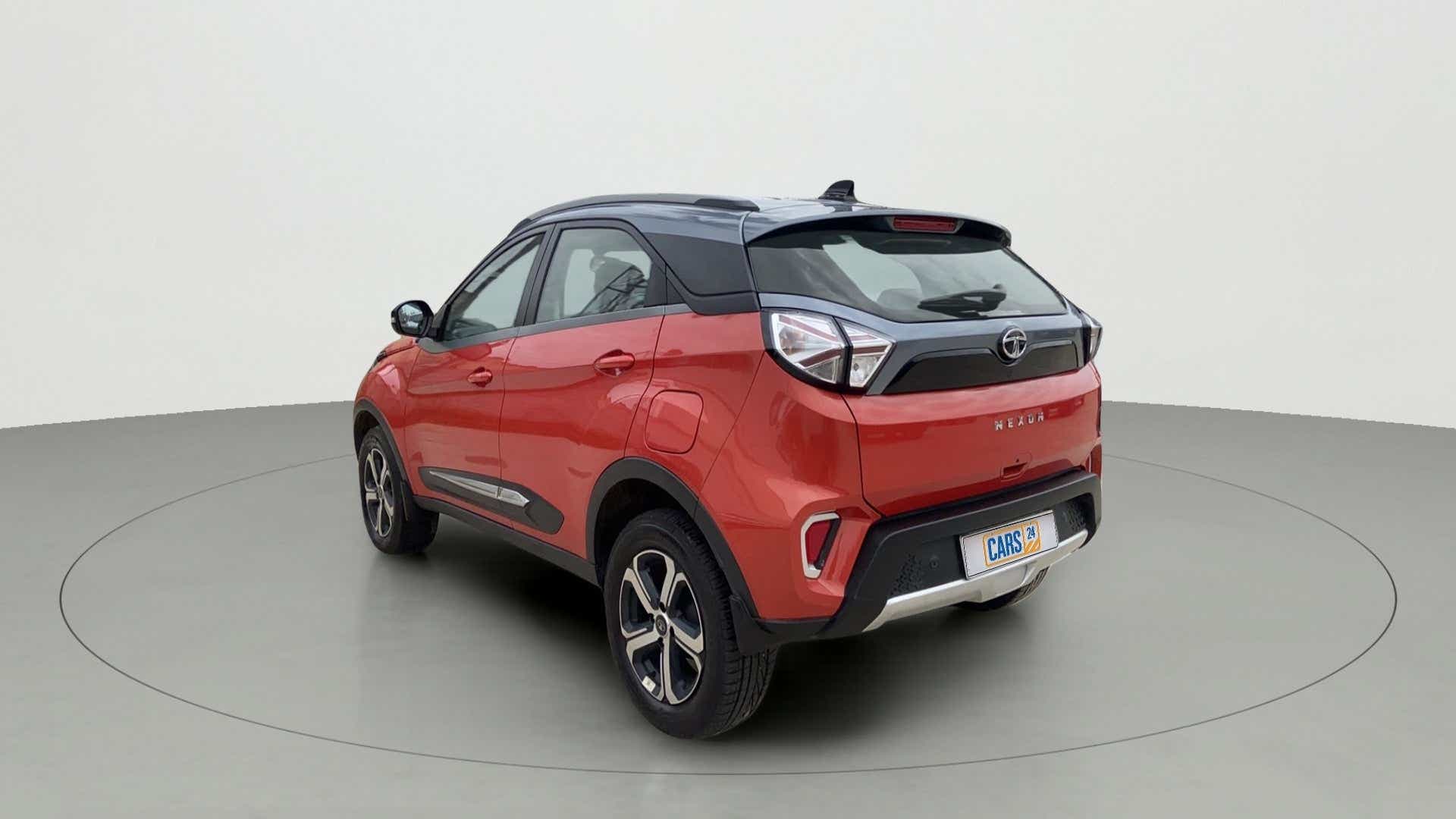 Rear three-quarter of a flame red Tata Nexon 2017-2023
