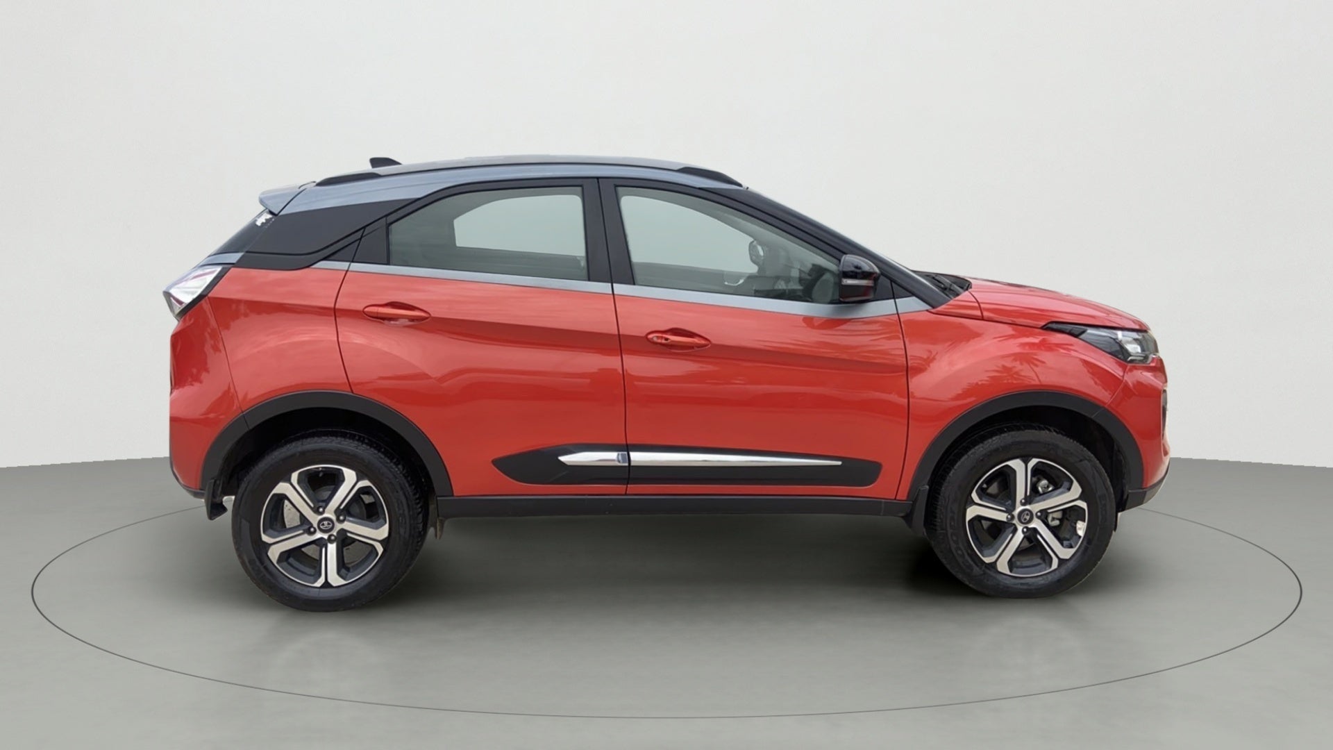 Side view of a Flame Red Tata Nexon 2017-2023