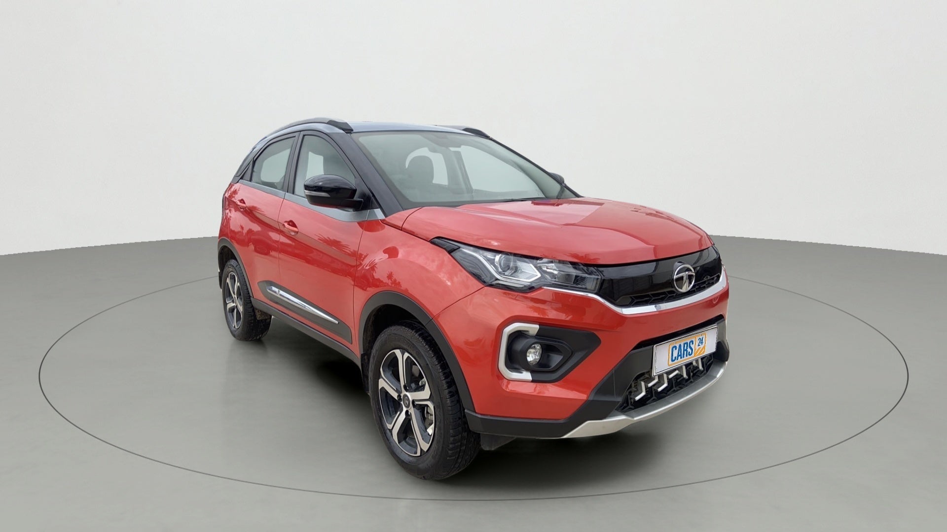 Front three-quarter view of a Flame Red Tata Nexon 2017-2023