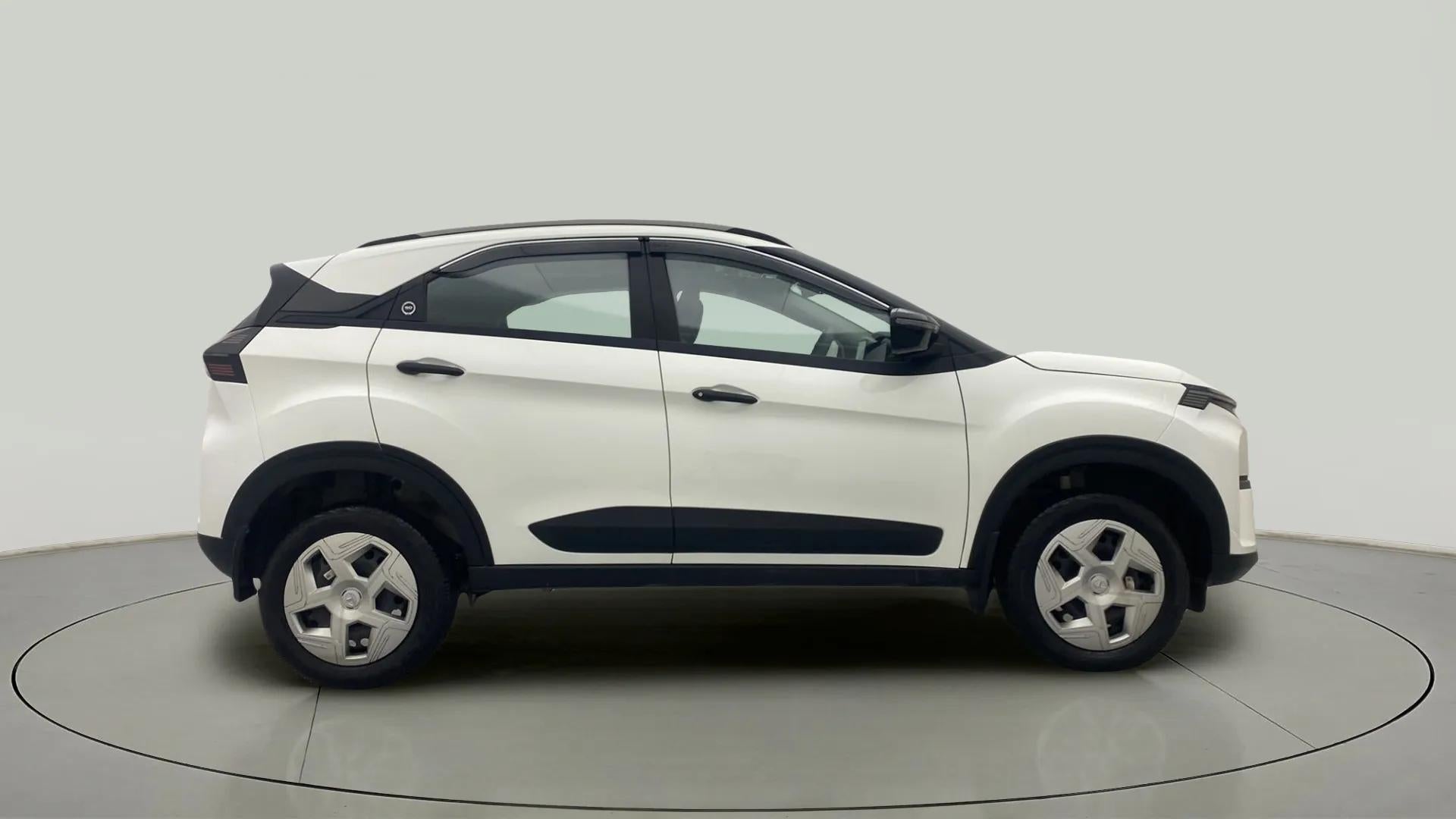 Side view of a Calgary White Tata Nexon 2017-2023