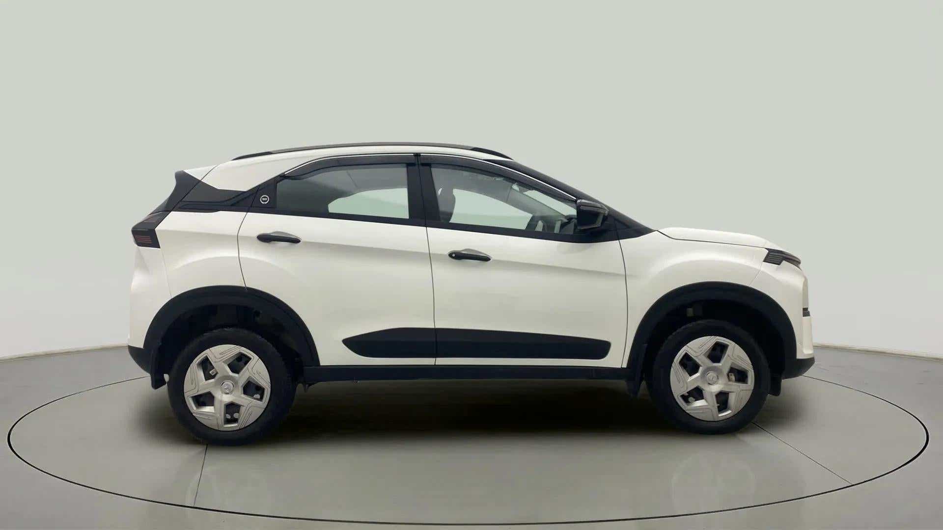 Side view of a Calgary White Tata Nexon 2017-2023