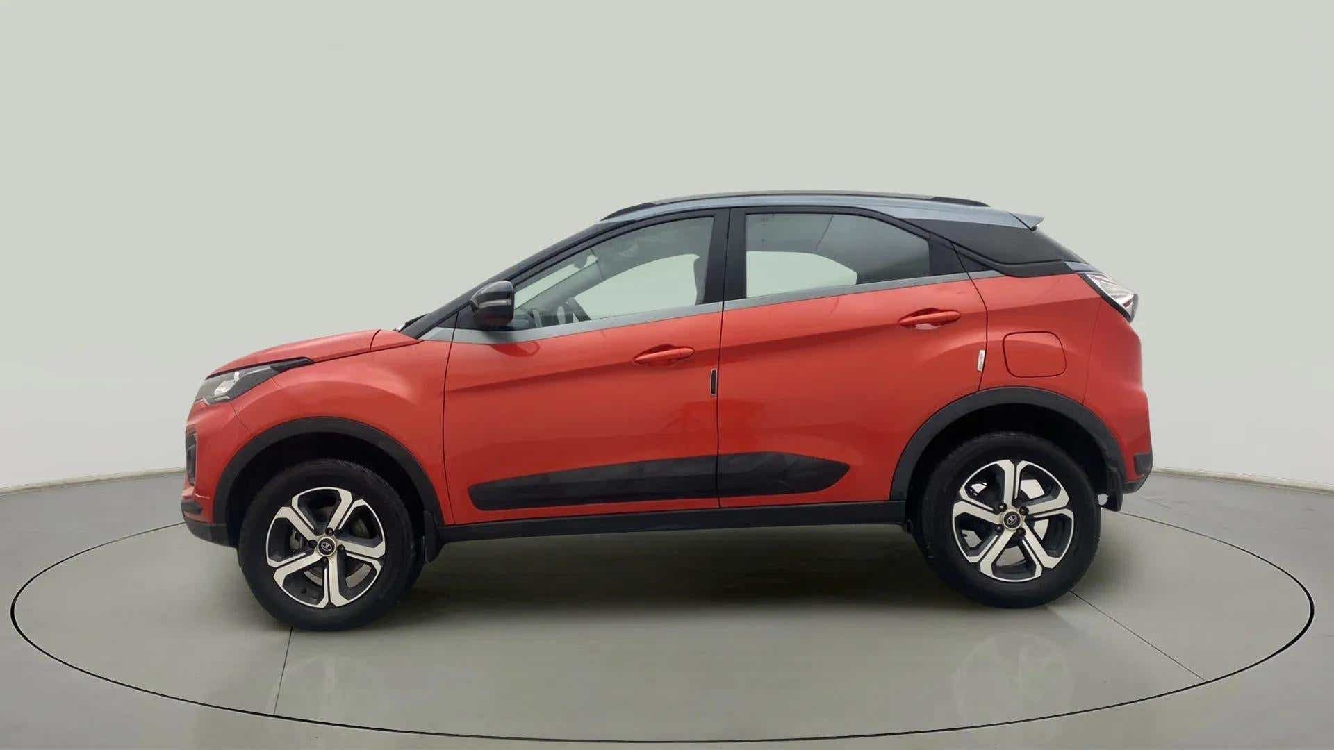 Left side view of a Flame Red Tata Nexon 2017-2023