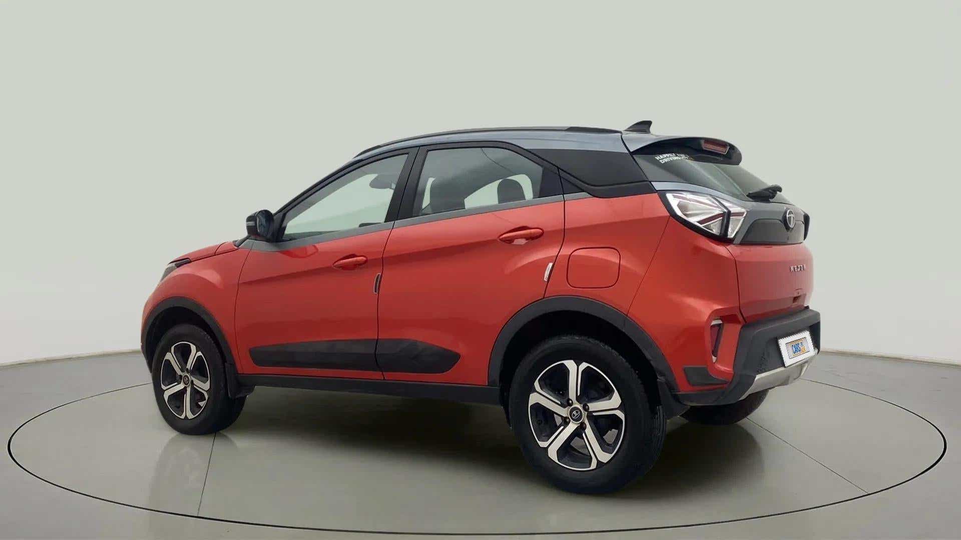 Rear three-quarter view of a Flame Red Tata Nexon 2017-2023
