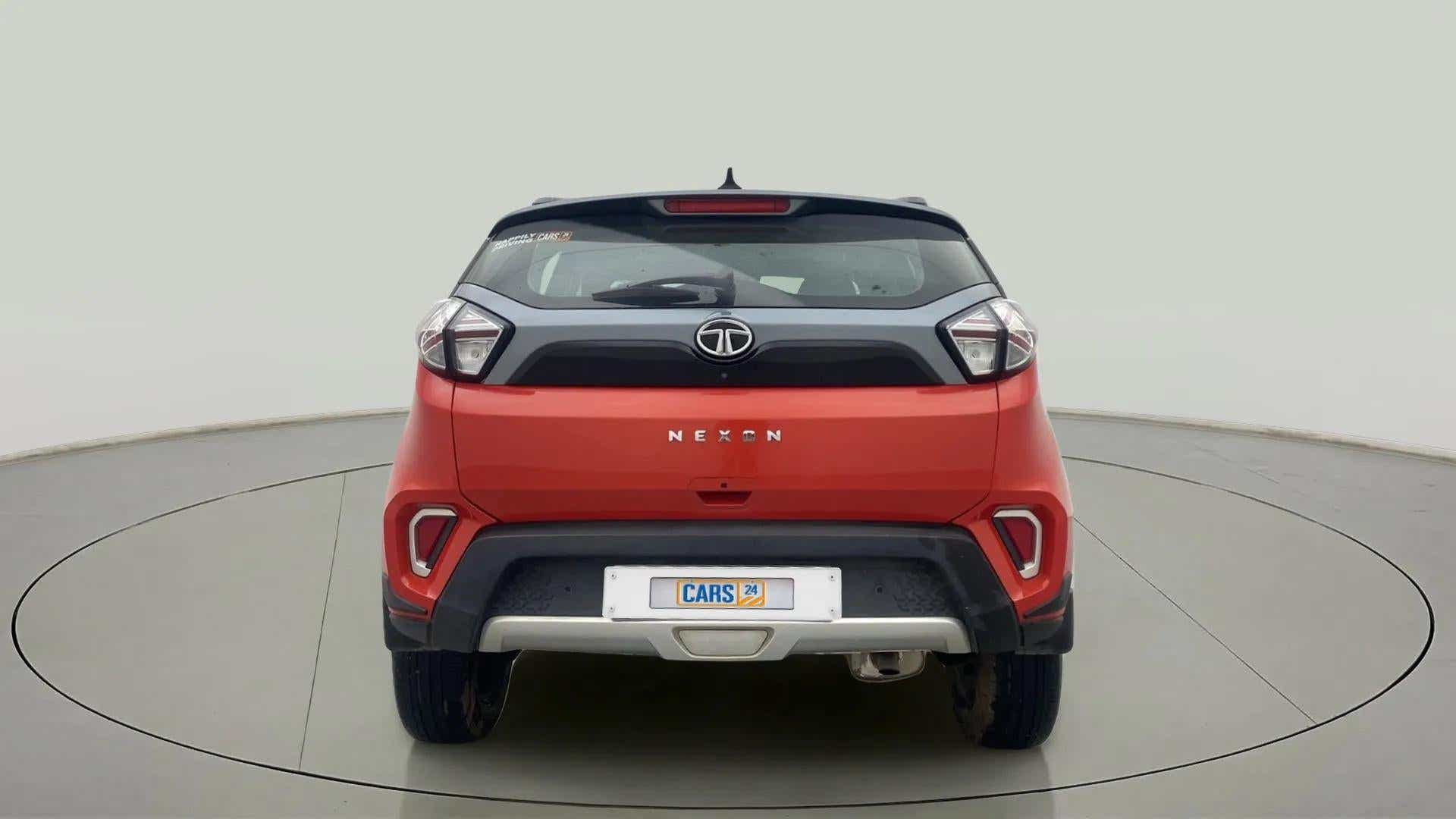 Rear view of a flame red Tata Nexon 2017-2023