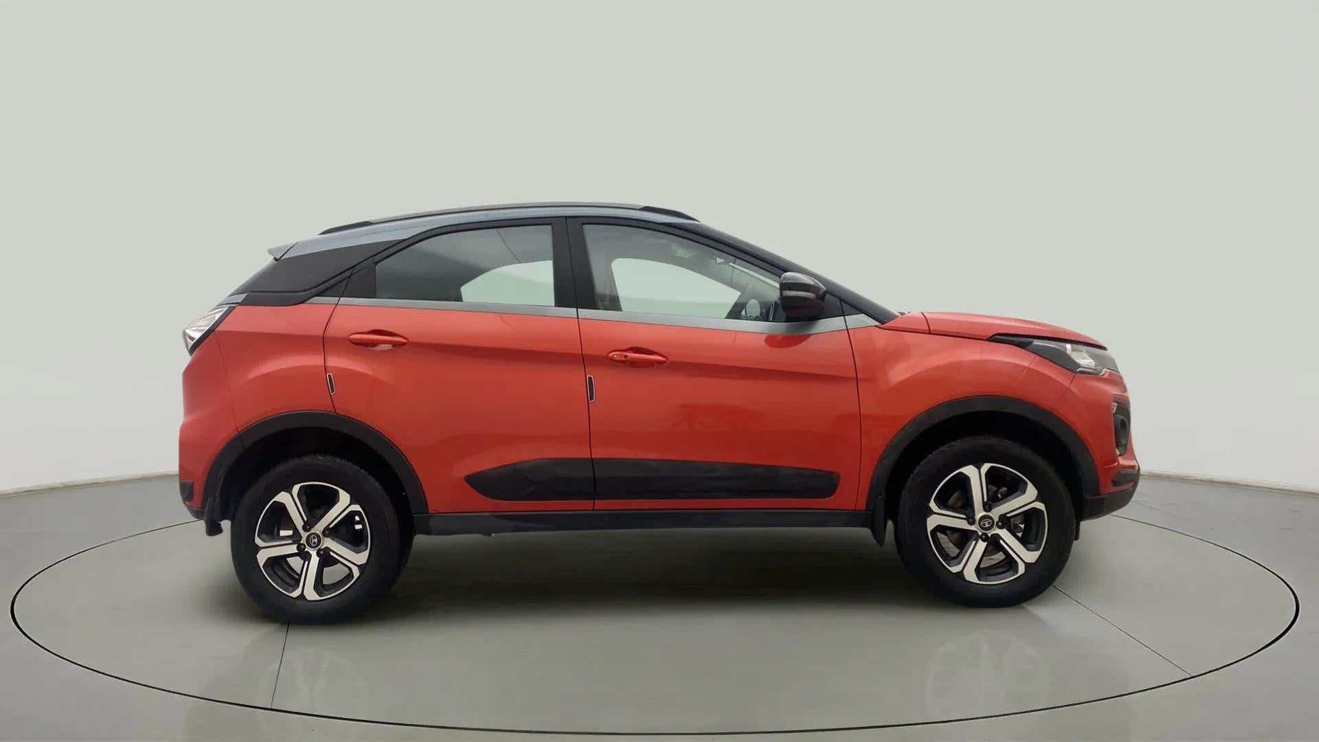 Side view of a flame red Tata Nexon 2017-2023