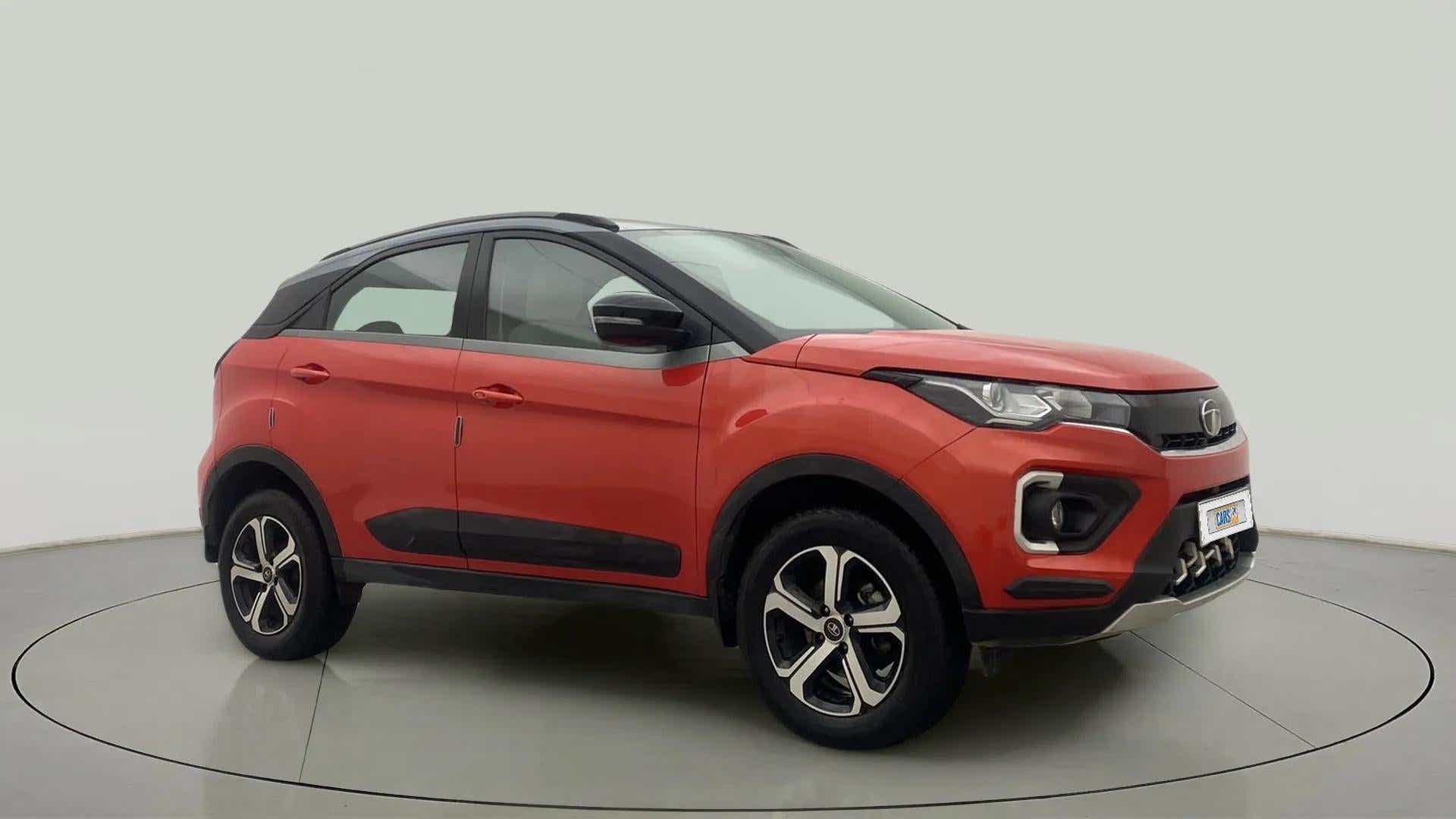 Front side view of a Flame Red Tata Nexon 2017-2023