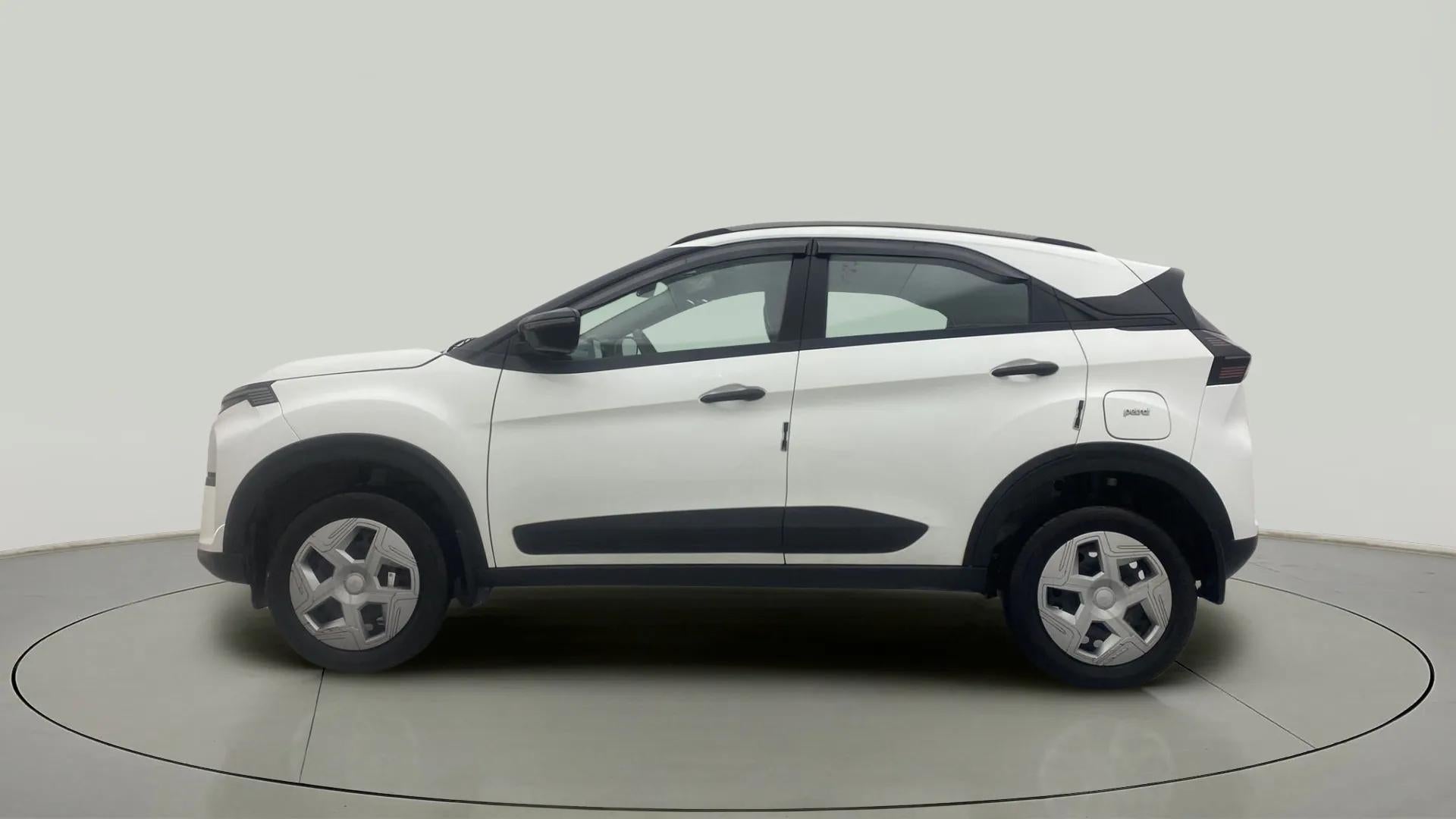 Side view of a Calgary White Tata Nexon